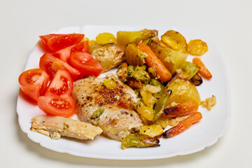 Portion of Pork Chop with Mediterranean Vegetables on a Plate