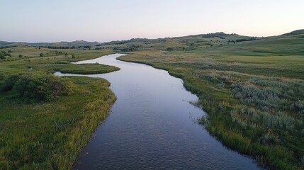 Serene River Winding Through Lush Prairie Landscape. Possible use Nature Photography, Backgrounds