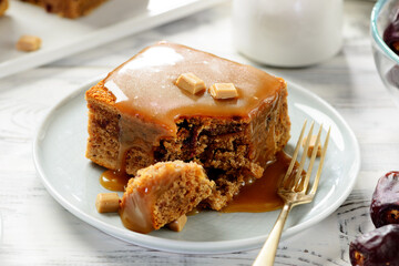 Easy Sticky Toffee Pudding is a deliciously gooey sponge cake drenched in warm toffee sauce.