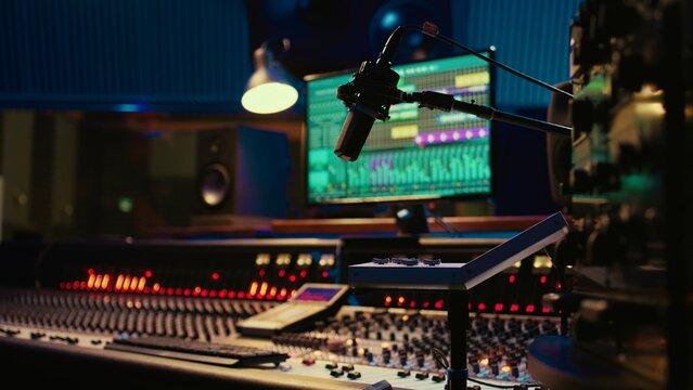 Music recording studio control room with pre amp knobs used for volume level adjustments. Stereo equipment as equalizer, mixer, switchers and sliders are operated in post production.