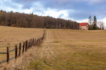 House on the edge of the forest. Early spring. Czechia.