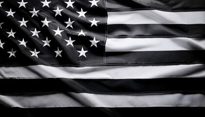 Black and white American flag waving gracefully in the wind, patriotism and freedom, with empty space for text or design