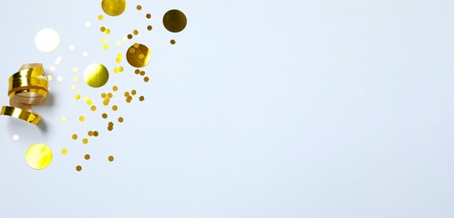Beautiful golden confetti on a white background