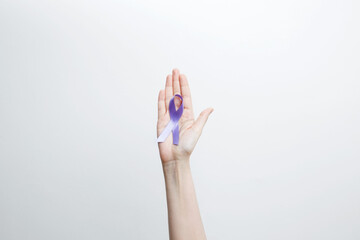 Purple Epilepsy Awareness Day, purple ribbon held, symbol of support