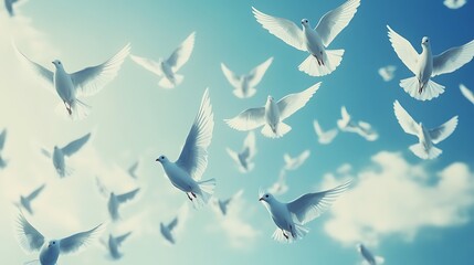 Flocks of white doves soaring in a vibrant blue sky. Possible use Inspirational, peace, hope, freedom