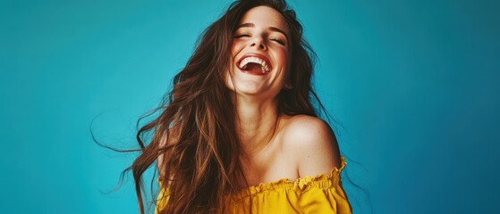 Woman smiling brightly against a vibrant blue background, capturing joy and happiness for lifestyle, fashion, or personal development themes in photography.