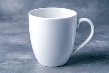 Obraz premium Elegant White Coffee Mug with Smooth Curved Design on Gray Background