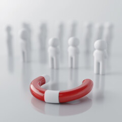 A conceptual image depicting customer attraction and marketing influence. A red and white horseshoe magnet is placed on a smooth, neutral-colored reflective surface