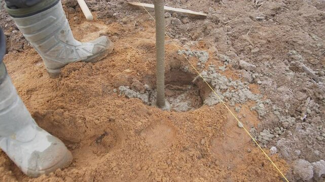 This image shows a closeup of the detailed soil drilling process, highlighting construction or agriculture elements