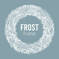 Frosted round frame with intricate ice patterns, clear lines, detailed textures. White icy wreath with detailed frost feathers on blue background. Winter abstract circle with delicate frozen elements.