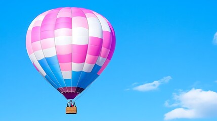 Obraz premium Pink White and Blue Striped Hot Air Balloon Soaring in a Clear Blue Sky on a Beautiful Sunny Day