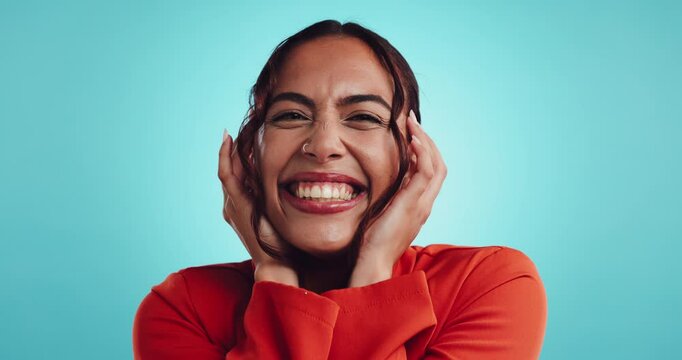 Psychology, face and woman with screaming in studio for depression, mental health and manic laughing. Bipolar, space and girl with shouting for anxiety, overwhelmed and psychosis on blue background