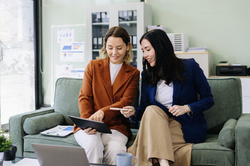 Diverse professionals collaborate on project data analysis, and teamwork in modern office.
