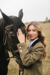 Fototapeta premium Woman Enjoying Pleasant Moment Outdoors with Her Horse Companion