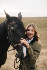 Obraz premium Smiling Woman Embracing Horse Outdoors in a Rustic Countryside Setting
