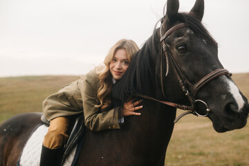 Fototapeta premium Cheerful Woman Enjoying Horseback Riding in a Scenic Countryside