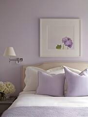 A serene lilac-themed bedroom with neutral decor and a framed white canvas above the headboard.