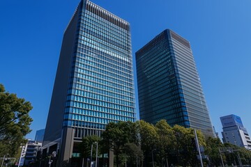 Fototapeta premium Modern skyscrapers in Tokyo, Japan with a blue sky background