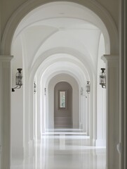 Obraz premium A serene, white marble corridor with an arched ceiling and a perfectly aligned white frame.