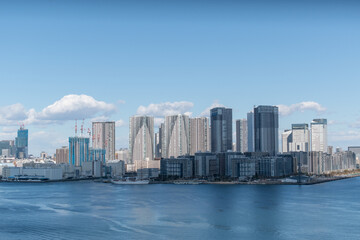 Fototapeta premium Tokyo Skyline under the blue sky on a sunny day