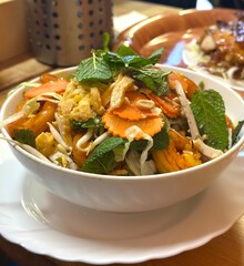 Vietnamese Shrimp Salad Bowl: A vibrant and appetizing bowl of Vietnamese shrimp salad, featuring succulent shrimp, shredded carrots, fresh herbs, and a light, flavorful dressing.
