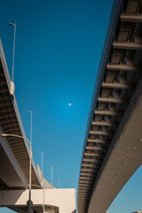 Road inside of bridge surounded by its structure in Tokyo, Japan. Rainbow Bridge