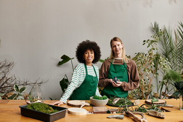 Creating vibrant plant arrangements at a lively workshop with friends enjoying their hobby
