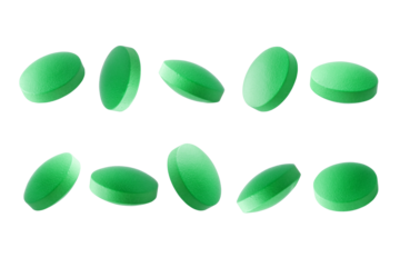 Set of green pills close up on a transparent background