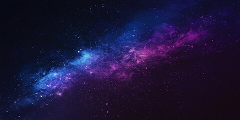 Obraz premium Cosmic Nebula in Vibrant Night Sky. A stunning cosmic scene featuring a vibrant nebula with shades of blue and purple, set against the vastness of a starry night sky.