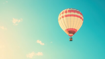 Fototapeta premium Colorful hot air balloon flying in a clear blue sky background. Retro color filter, 35mm film look, photorealistic