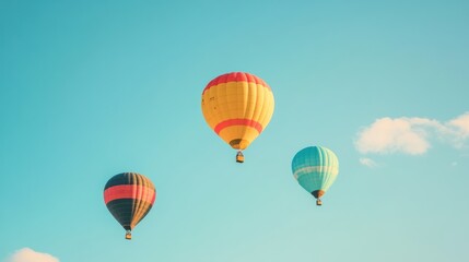Naklejka premium Colorful hot air balloons flying in a clear blue sky. The concept of travel, adventure, and the romanticism of flight