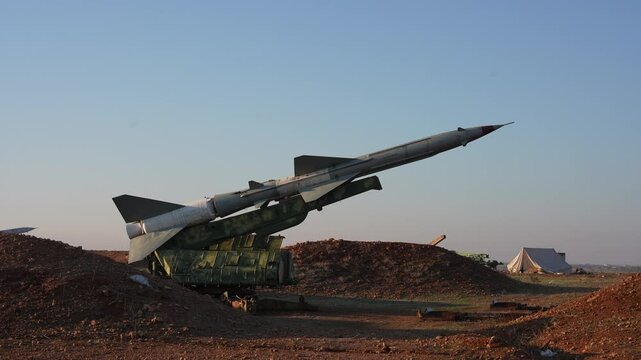 Military equipment in Syria, missiles and tanks.