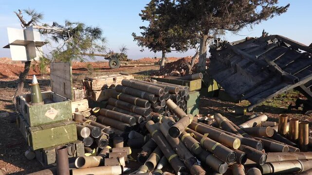 Military aircraft and missiles at a Syrian military site targeted by Israel. Conflict in the Middle East.