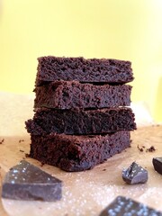pieces of delicious chocolate brownie stacked one on top of the other