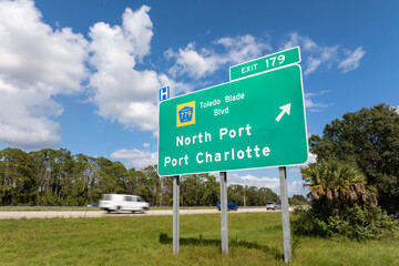 Freeway directional exit sign on interstate road in Florida, USA. I-75 highway junction leading to...