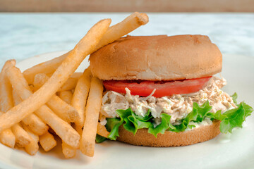chicken salad sandwich  with fries,