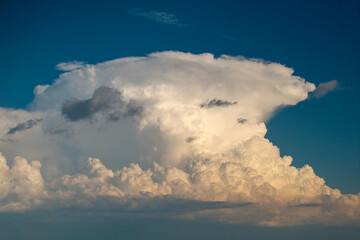 Rain clouds forming on blue Florida sky. Colorful summer skyscape