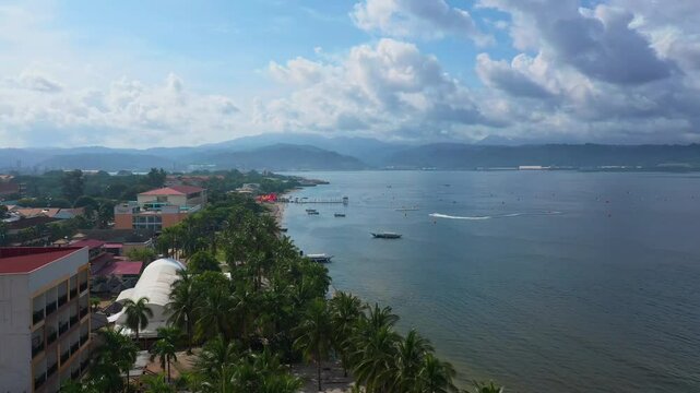 A sweeping wide drone shot captures the stunning Subic ocean, where jet skis race across the waves and boats glide effortlessly.