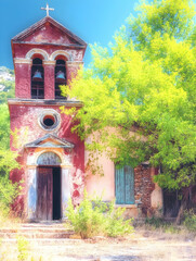 Historic church facade with bells and stone steps in scenic outdoors. Faith and travel related background use for church or holiday themes