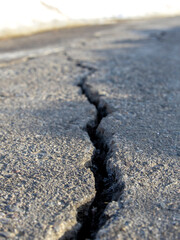 Crack in the pavement is shown in the image