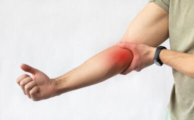 The man suffers from severe pain in his elbow