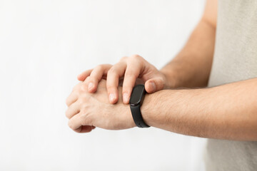 Fototapeta premium Close-up shot of man with smart band isolated on white background