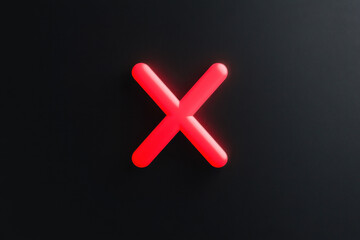 Obraz premium Glowing red x symbol on dark surface