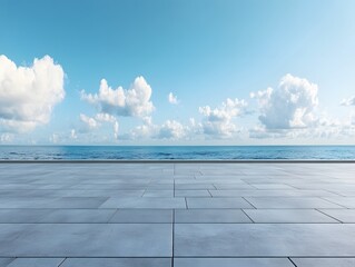 Serene Ocean View from a Modern Stone Terrace Under a Bright Blue Sky with Fluffy Clouds