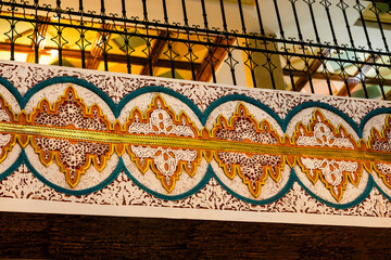 Interior of Moroccan building, colorful and creative traditional, tiles and lamps.