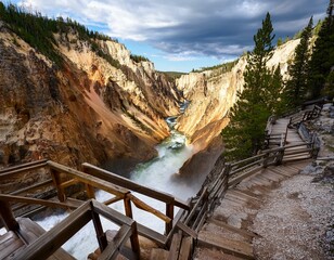 stormy river flows in a narrow gorge in the rocks steps down to the bottom of the gorge uncle toms trail on the grand canyon of the yellowstone national park wyoming