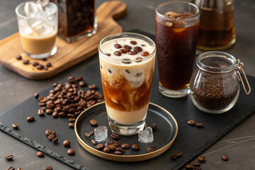 A refreshing Espresso Tonic, expertly crafted with bold espresso and fizzy tonic, served over ice in a sleek glass, creating a perfect balance of rich and effervescent flavors. 