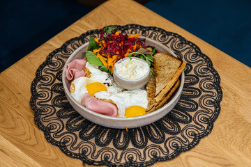 Delicious breakfast with eggs, bacon, cheese and more