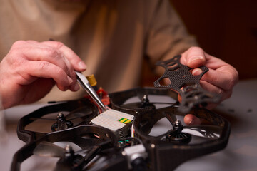 Conducting Detailed and Precise Repair Work Using Various Tools and Electronic Components