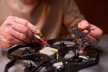 Conducting Detailed and Precise Repair Work Using Various Tools and Electronic Components